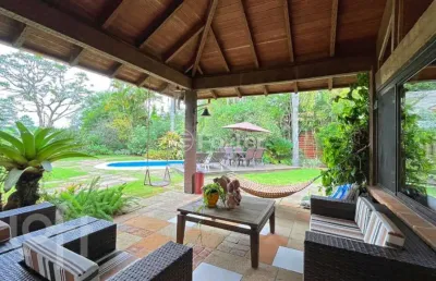Casa em condomínio fechado com 6 quartos à venda na avenida juca batista, 8000, belém novo, porto alegre, 450 m2 por r$ 2.900.000