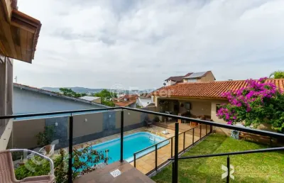 Casa com 3 quartos à venda na rua inês vinhas, 45, espírito santo, porto alegre, 350 m2 por r$ 1.050.000