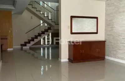 Casa com 4 quartos à venda na avenida fábio araújo santos, 1164, nonoai, porto alegre, 329 m2 por r$ 1.138.100