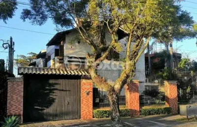 Casa em condomínio fechado com 3 quartos à venda na avenida guaíba, 10930, ipanema, porto alegre, 190 m2 por r$ 750.000