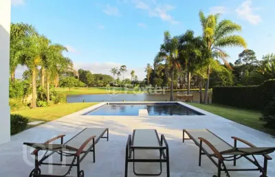 Casa em condomínio fechado com 3 quartos à venda na avenida juca batista, 8000, belém novo, porto alegre, 450 m2 por r$ 5.250.000