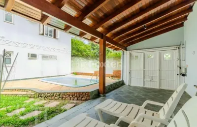 Casa em condomínio fechado com 5 quartos à venda na avenida juca batista, 1200, belém novo, porto alegre, 300 m2 por r$ 1.250.000