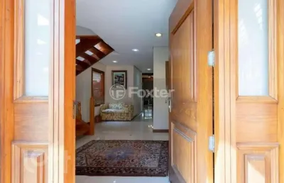 Casa em condomínio fechado com 3 quartos à venda na avenida juca batista, 8000, belém novo, porto alegre, 294 m2 por r$ 1.300.000