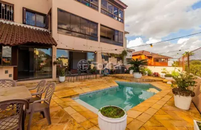 Casa com 4 quartos à venda na rua luiz voelcker, 351, três figueiras, porto alegre, 350 m2 por r$ 1.650.000