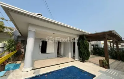 Casa com 3 quartos à venda na avenida flávio boianovski, 918, centro, capão da canoa, 172 m2 por r$ 1.280.000