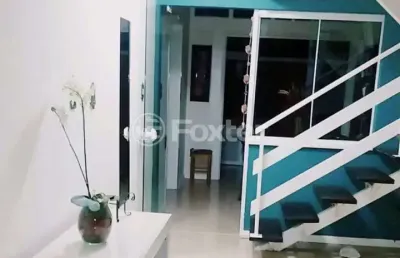 Casa em condomínio fechado com 3 quartos à venda na avenida juca batista, 1490, cavalhada, porto alegre, 122 m2 por r$ 555.000