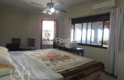 Casa com 4 quartos à venda na avenida fábio araújo santos, 1472, nonoai, porto alegre, 352 m2 por r$ 950.000