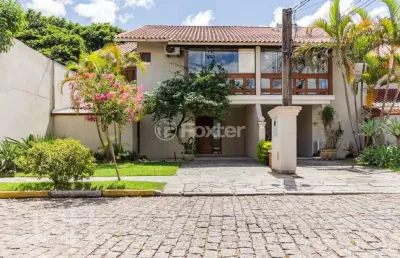 Casa em condomínio fechado com 3 quartos à venda na avenida eduardo prado, 2050, cavalhada, porto alegre, 233 m2 por r$ 1.080.000