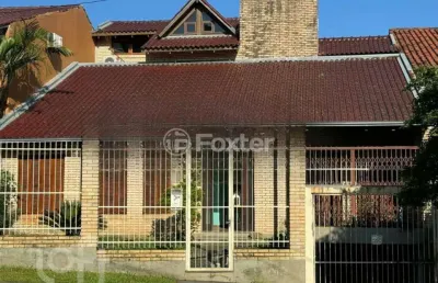 Casa com 3 quartos à venda na rua alcebíades antônio dos santos, 107, nonoai, porto alegre, 423 m2 por r$ 990.000