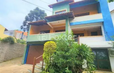 Casa com 3 quartos à venda na rua theonila carvalho da motta, 80, parque santa fé, porto alegre, 438 m2 por r$ 1.150.000