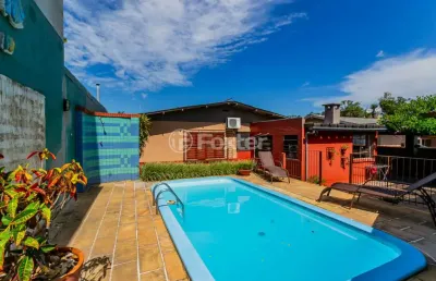 Casa em condomínio fechado com 3 quartos à venda na avenida edgar pires de castro, 2603, hípica, porto alegre, 148 m2 por r$ 636.000