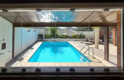Casa com 4 quartos à venda na rua carlos huber, 826, três figueiras, porto alegre, 318 m2 por r$ 1.616.000