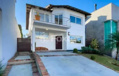 Casa em condomínio fechado com 3 quartos à venda na avenida senador salgado filho, 8500, vila augusta, viamão, 180 m2 por r$ 899.000