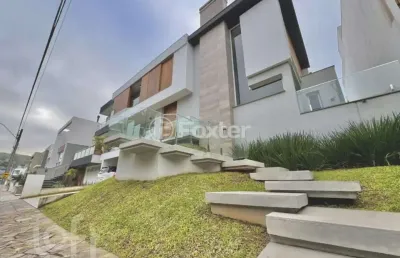 Casa em condomínio fechado com 4 quartos à venda na avenida edgar pires de castro, 1780, hípica, porto alegre, 488 m2 por r$ 3.180.000