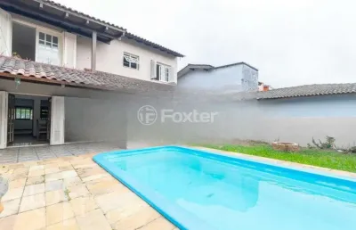 Casa com 4 quartos à venda na avenida guaíba, 13166, guarujá, porto alegre, 334 m2 por r$ 900.000