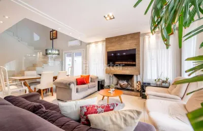 Casa em condomínio fechado com 4 quartos à venda na avenida juca batista, 8000, chapéu do sol, porto alegre, 219 m2 por r$ 1.750.000
