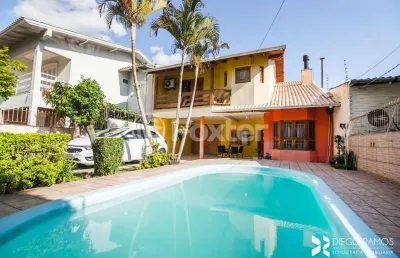 Casa com 4 quartos à venda na rua cacilda yaconis becker, 223, rubem berta, porto alegre, 300 m2 por r$ 693.500