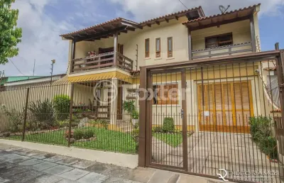 Casa com 4 quartos à venda na avenida josé corrêa da silva, 117, cavalhada, porto alegre, 318 m2 por r$ 800.000