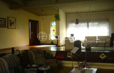 Casa com 4 quartos à venda na rua jacipuia, 201, guarujá, porto alegre, 464 m2 por r$ 1.300.000
