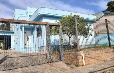 Casa com 5 quartos à venda na rua leão licurgo brasiliano arano, 125, vila nova, porto alegre, 312 m2 por r$ 850.000