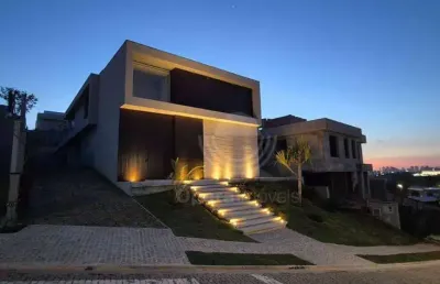 Casa de alto padrão em condomíno conceituado com 4 suítes à venda, 559 m² por r$ 6.400.000 - residencial jatibela - campinas/sp