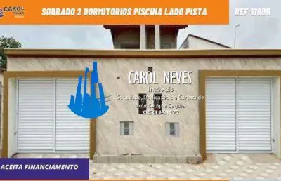 Sobrado 2 dormitorios piscina lado pista financiamento bancario mongagua