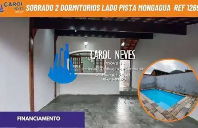 Sobrado geminado 2 dormitorios piscina lado pista financiamento mongagua