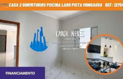 Casa 2 dormitorios 1 suite piscina lado pista financiamento mongagua
