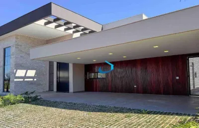 Casa nova térrea alto padrão condomínio villagio do engenho a fachada é imponente com detalhes em pedra, vidro e led 4 suítes 6 vagas piscina