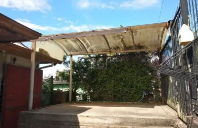 Casa 2 dormitórios, sala, banheiro garagem coberta, terreno 694m² bairro camaquã