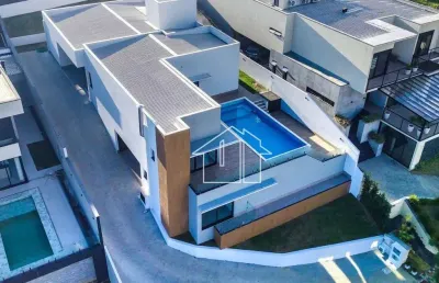 Casa com 5 dormitórios à venda, 370 m² por r$ 5.400.000,00 - condomínio reserva do paratehy - são josé dos campos/sp