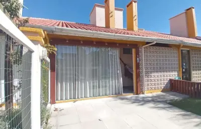 Sobrado geminado 2 dorm à venda no bairro capão novo - 2 vagas de garagem