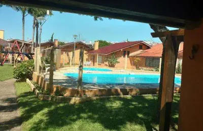 Sobrado 02 dorm à venda no bairro capão novo com 70 m² de área privativa - 2 vagas de garagem