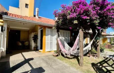 Sobrado 03 dorm à venda no bairro capão novo com 100 m² de área privativa - 2 vagas de garagem