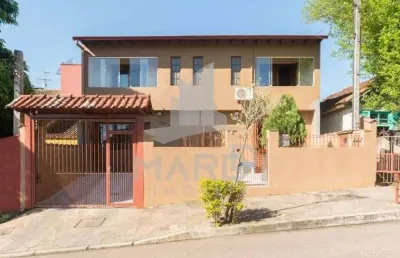 Casa com 4 quartos à venda na rua adroaldo novo correa, 126, cavalhada, porto alegre por r$ 650.000