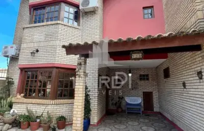 Casa com 3 quartos à venda na rua jacundá, 641, guarujá, porto alegre por r$ 585.000