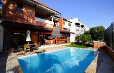 Casa com 4 quartos à venda na rua alcebíades antônio dos santos, 157, nonoai, porto alegre por r$ 1.650.000
