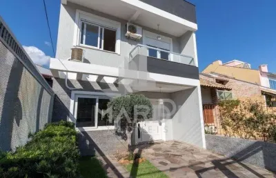 Casa em condomínio fechado com 3 quartos à venda na rua felipe arísio, 121, hípica, porto alegre por r$ 790.000
