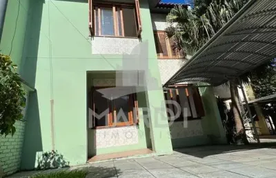 Casa em condomínio fechado com 3 quartos à venda na avenida juca batista, 4115, hípica, porto alegre por r$ 425.000