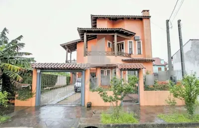 Casa com 4 quartos à venda na rua ocimar antonio pereira, 79, hípica, porto alegre por r$ 590.000