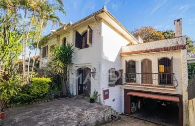 Casa com 5 quartos à venda na rua professor ivo corseuil, 129, petrópolis, porto alegre por r$ 1.350.000