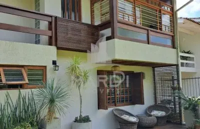 Casa com 4 quartos à venda na rua olécio cavedini, 235, ipanema, porto alegre por r$ 789.000