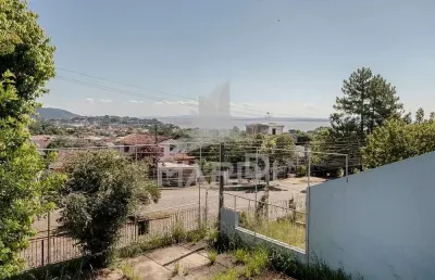 Casa com 3 quartos à venda na avenida leonardo carlucci, 140, espírito santo, porto alegre por r$ 550.000