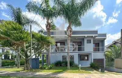 Casa em condomínio fechado com 4 quartos à venda na rua tocantins, 937, lomba do pinheiro, porto alegre por r$ 1.389.000