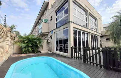 Casa em condomínio fechado com 3 quartos à venda na avenida juca batista, 473, ipanema, porto alegre