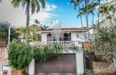 Casa com 3 quartos à venda na rua oscar tollens, 170, santa tereza, porto alegre por r$ 450.000