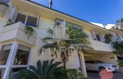 Casa em condomínio fechado com 3 quartos à venda na rua doutor arnaldo da silva ferreira, 465, jardim isabel, porto alegre por r$ 1.150.000
