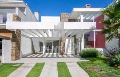 Casa em condomínio fechado com 5 quartos à venda na avenida juca batista, 8000, belém novo, porto alegre por r$ 1.650.000