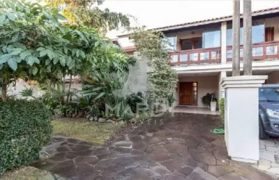 Casa em condomínio fechado com 3 quartos à venda na avenida eduardo prado, 2050, cavalhada, porto alegre por r$ 960.000