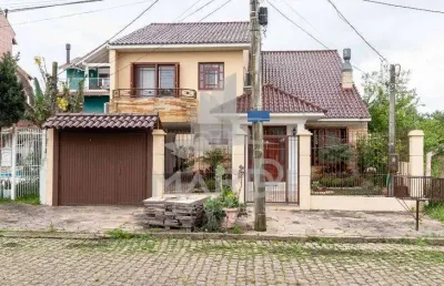 Casa com 3 quartos à venda na avenida guaíba, 13914, ipanema, porto alegre por r$ 990.000